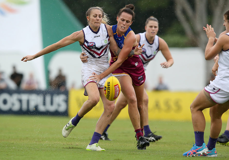 AFLW 2018 Rd 04 - Brisbane Lions v Fremantle BRISBANE, AUSTRALIA - FEBRUARY 24: Fremantle player Melissa Caulfield contests the ball with Brisbane player Emma Zielke during the round four AFLW match between the Brisbane Lions and the Fremantle Dockers at South Pine Sports Complex on February 24, 2018 in Brisbane, Australia. (Photo by Jono Searle/Getty Images/AFL Media)